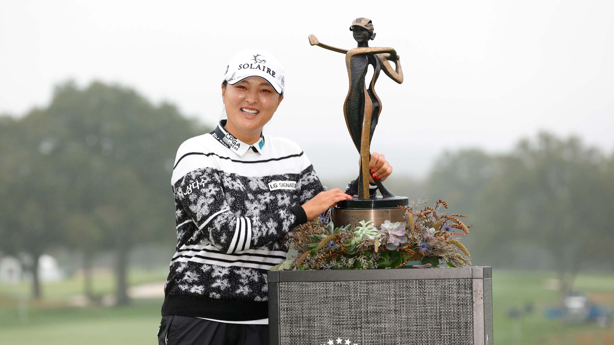Tournament champion Jin Young Ko of Korea poses with the trophy after winning on the 18th green during the final round of the Cognizant Founders Cup
